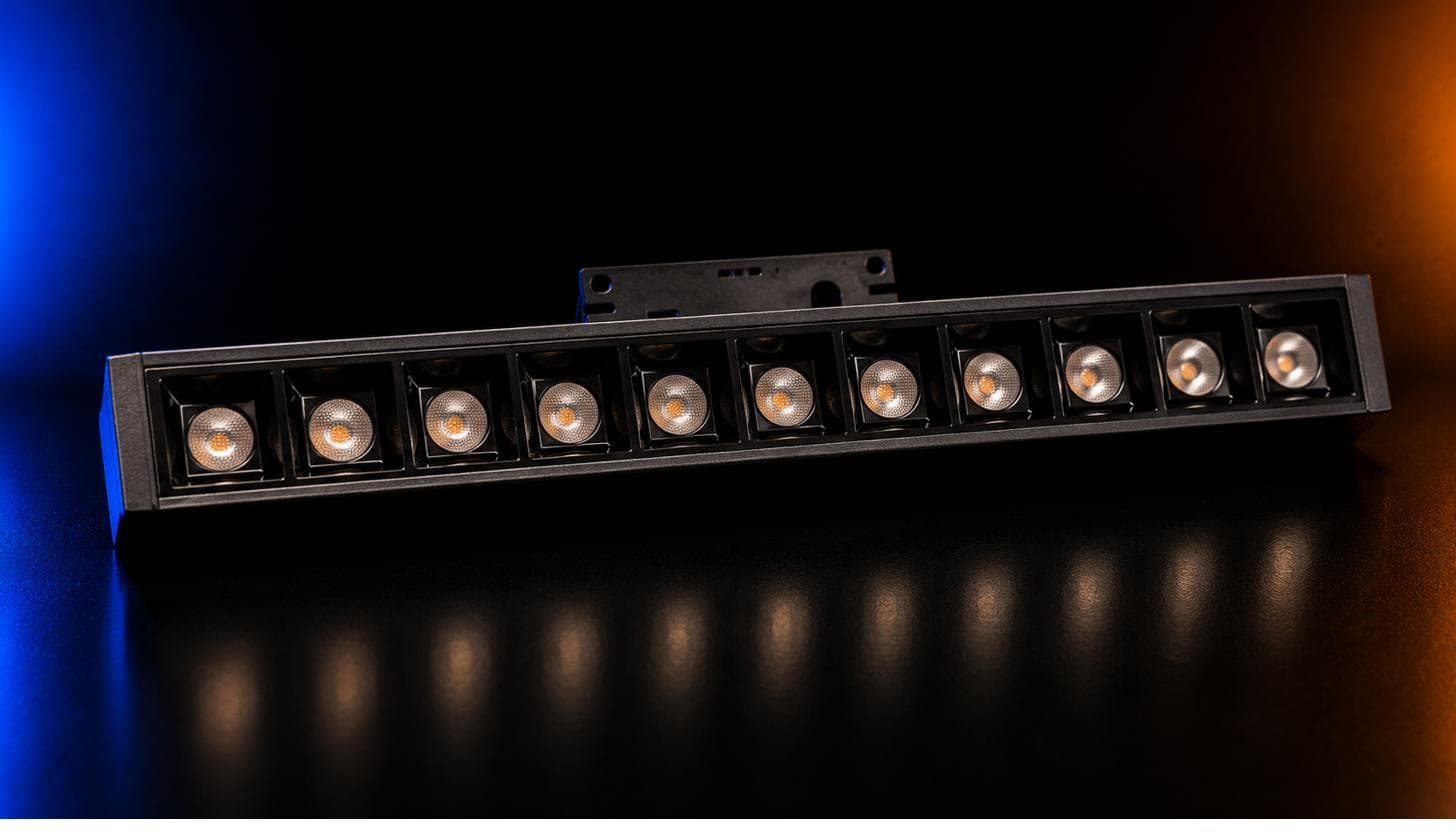 Magnetic Laser Blade — black linear bar with a row of round lenses