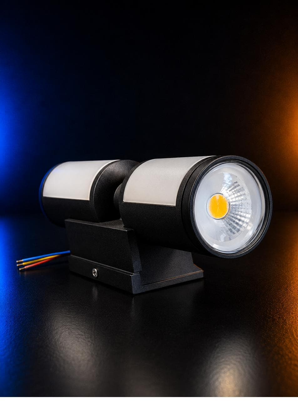 Twin-Barrel Wall Light — black up/down cylinders with silver mid-bands